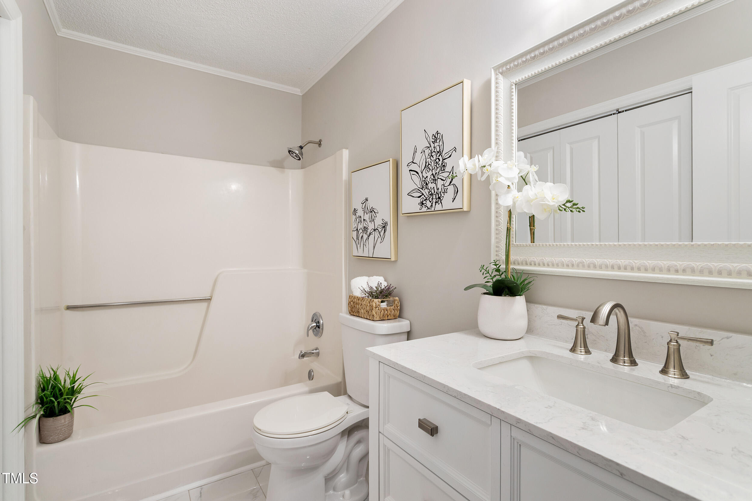 118 Rhum Place Garner, NC 27529 - Photo 8 of 26 a bathroom with a granite countertop toilet sink and mirror