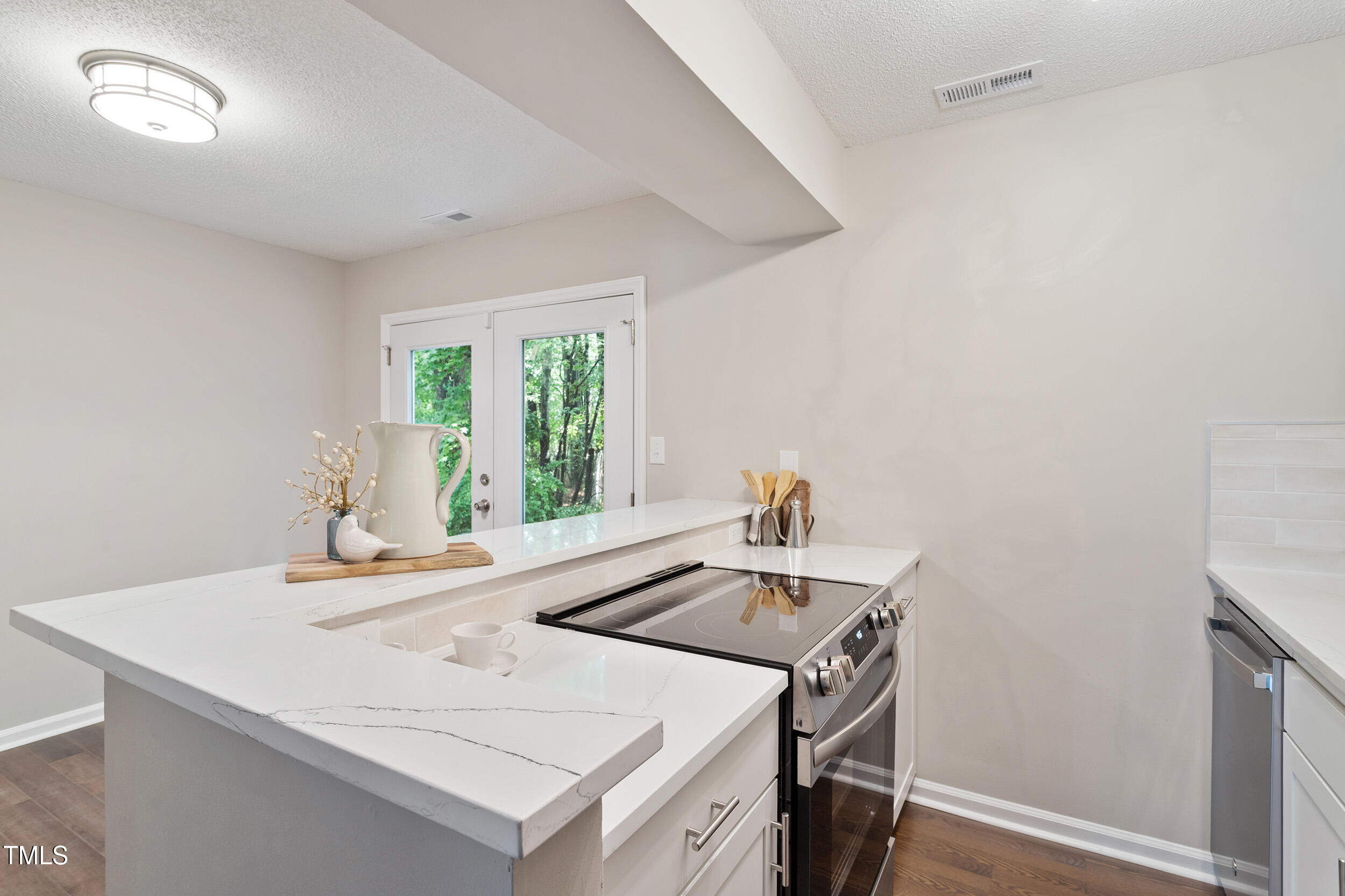 118 Rhum Place Garner, NC 27529 - Photo 10 of 26 a kitchen that has a sink and a stove in it