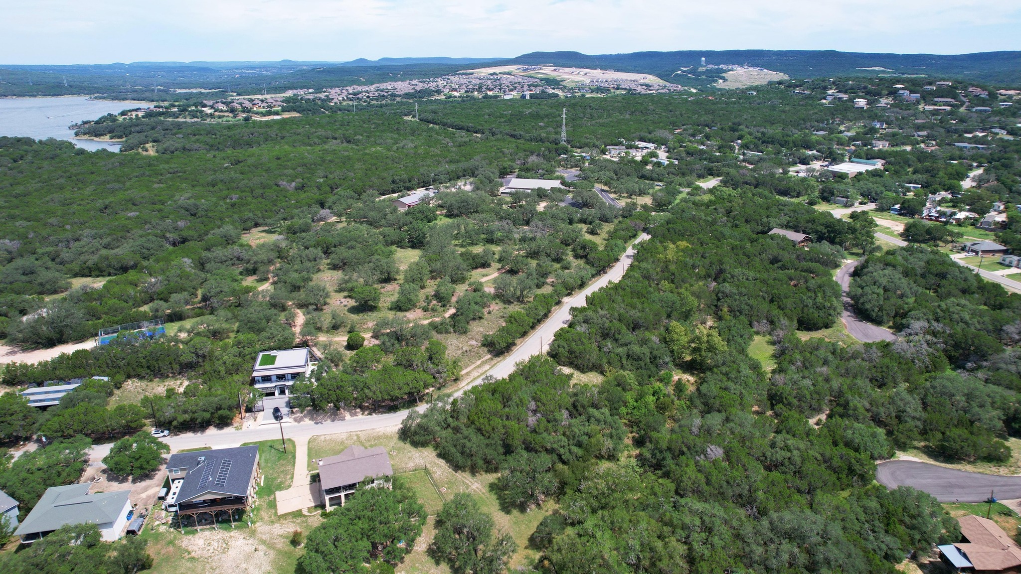 6719 Bar K Ranch Road Lago Vista, TX 78645 - Photo 15 of 36 an aerial view of residential houses with outdoor space and trees