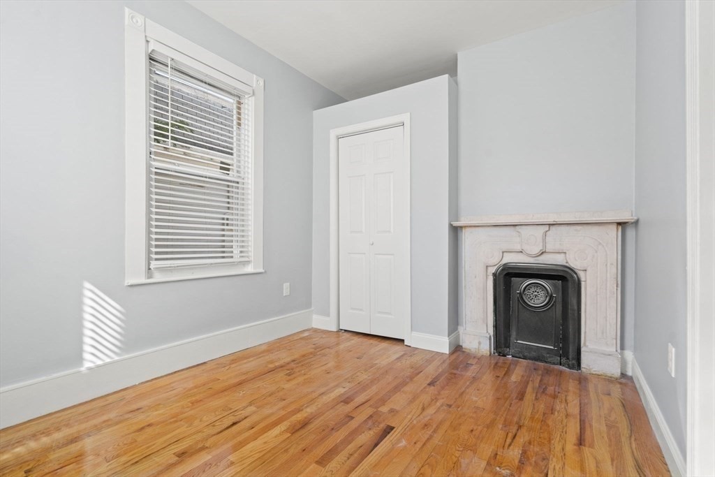 8 North Avenue, Unit 1 Boston, MA 02119 - Photo 11 of 15 a view of a livingroom with a fireplace
