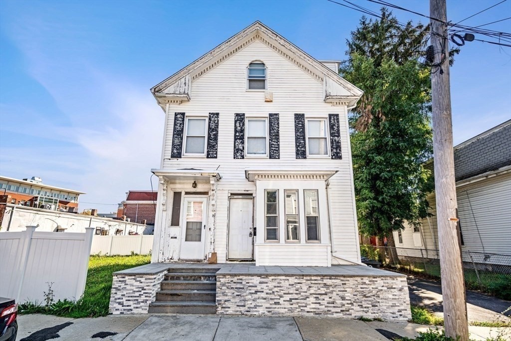 8 North Avenue, Unit 1 Boston, MA 02119 - Photo 13 of 15 front view of a house with a yard
