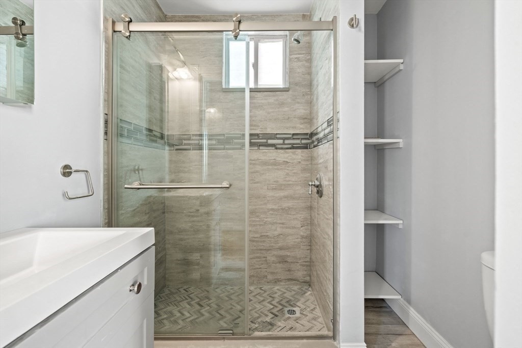 8 North Avenue, Unit 1 Boston, MA 02119 - Photo 10 of 15 a bathroom with a shower and a sink
