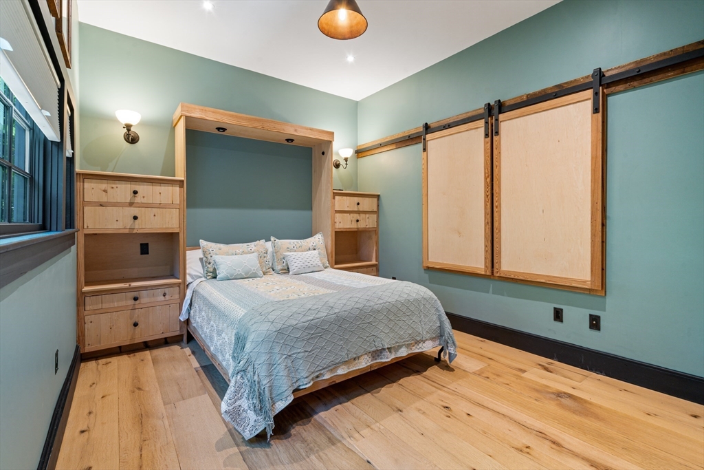 7 Brewer Street, Unit 1 Boston, MA 02130 - Photo 11 of 15 a bedroom with a large bed and a window