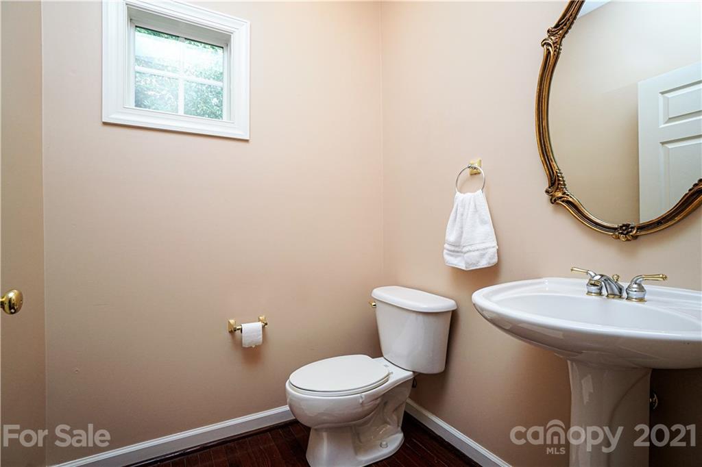 914 Chevis Court Fort Mill, SC 29708 - Photo 11 of 47 a bathroom with a toilet sink and mirror