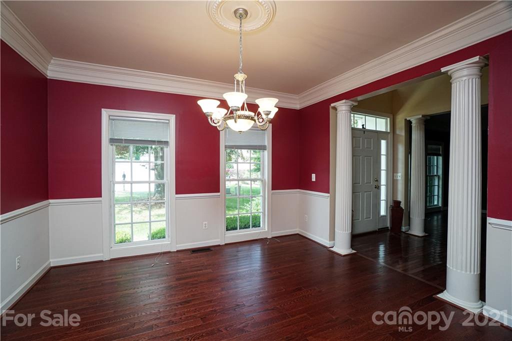 914 Chevis Court Fort Mill, SC 29708 - Photo 14 of 47 a hallway with a chandelier wooden floor and a chandelier