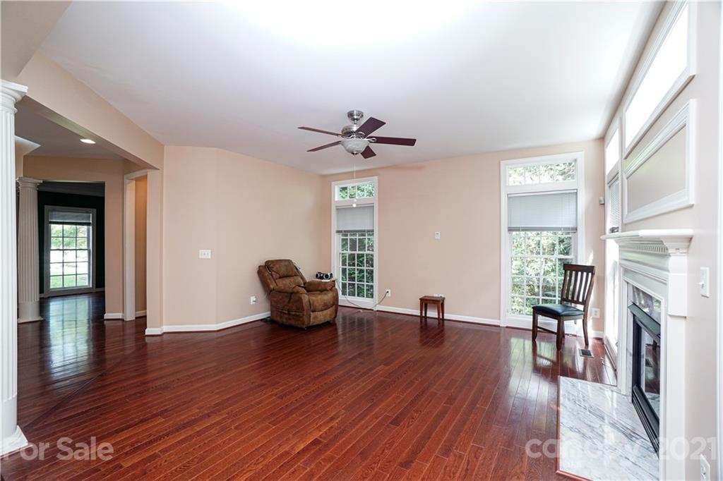 914 Chevis Court Fort Mill, SC 29708 - Photo 21 of 47 a living room with furniture wooden floor and a fireplace