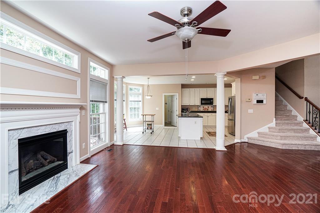 914 Chevis Court Fort Mill, SC 29708 - Photo 23 of 47 a view of a livingroom with wooden floor and a fireplace