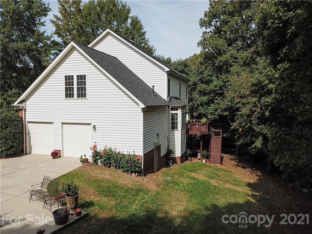 914 Chevis Court Fort Mill, SC 29708 - Photo 4 of 47 a view of a backyard with a garden and entertaining space