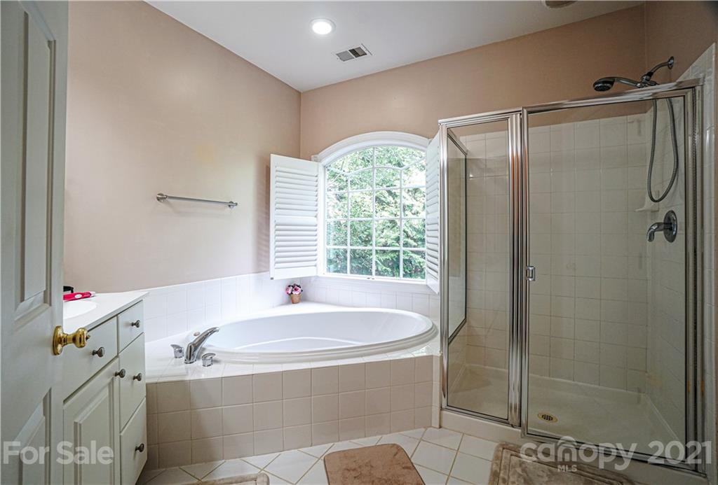 914 Chevis Court Fort Mill, SC 29708 - Photo 46 of 47 a bathroom with a tub and shower