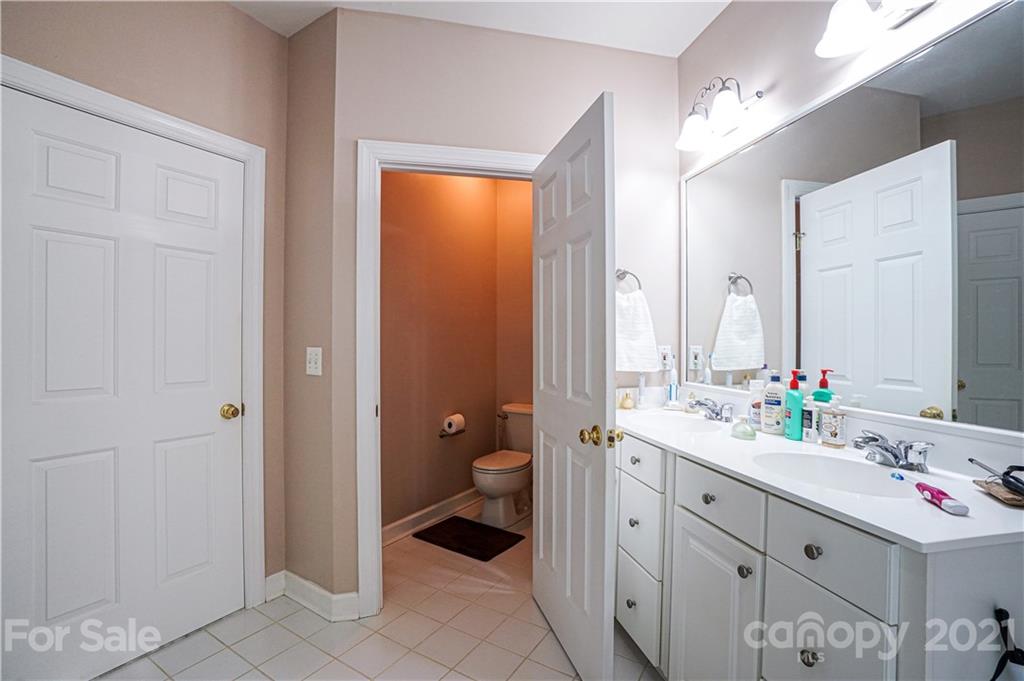 914 Chevis Court Fort Mill, SC 29708 - Photo 47 of 47 a bathroom with a double vanity sink toilet and shower