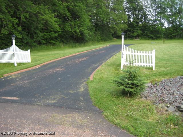 3530 Nashotka Road Moscow, PA 18444 - Photo 4 of 44 a view of a swimming pool with a garden