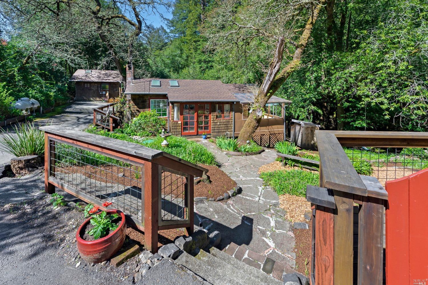 a front view of a house with garden