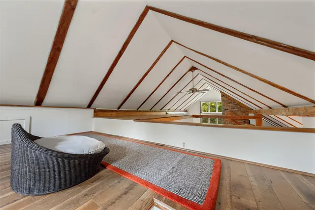 a view of entryway with a rug and toilet