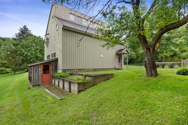 a backyard of a house with lots of green space