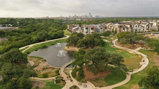 an aerial view of residential houses with outdoor space