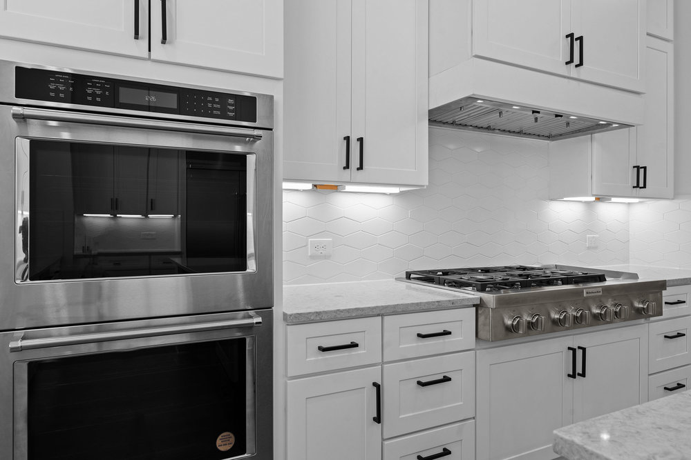 4309 Prevail Lane, Unit 18 Austin, TX 78731 - Photo 28 of 40 a stove top oven sitting inside of a kitchen