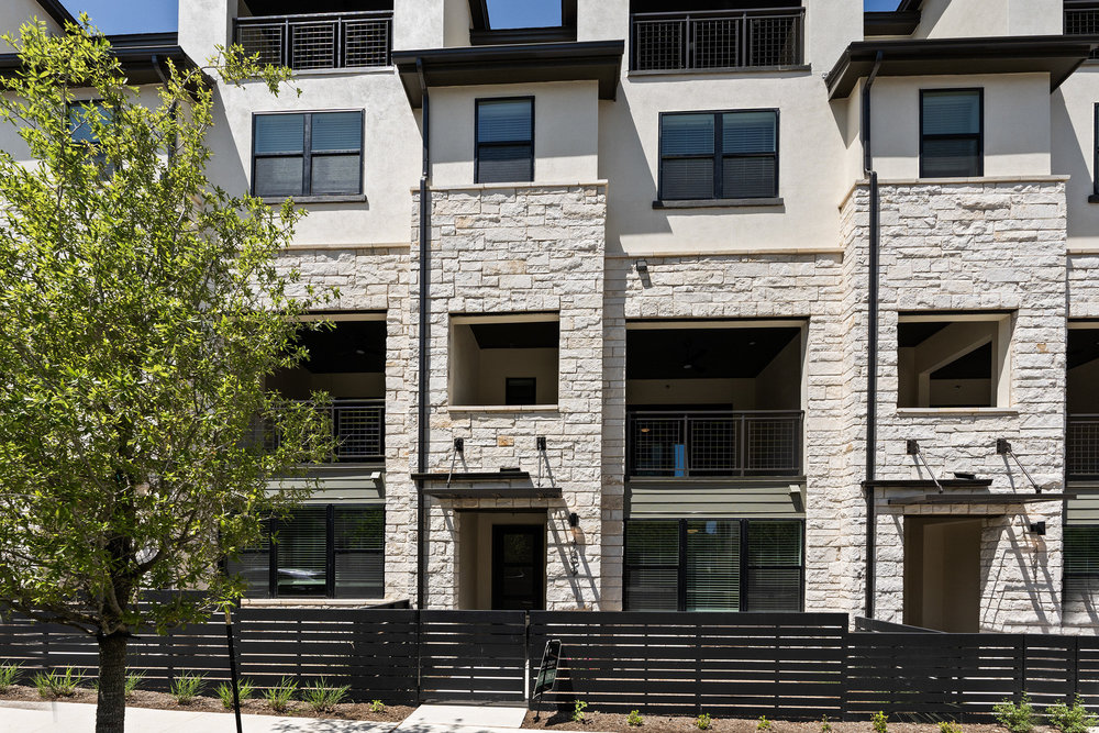 4309 Prevail Lane, Unit 18 Austin, TX 78731 - Photo 40 of 40 a building with a door and balcony