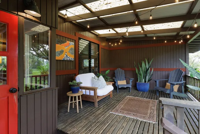 a patio with table and chairs