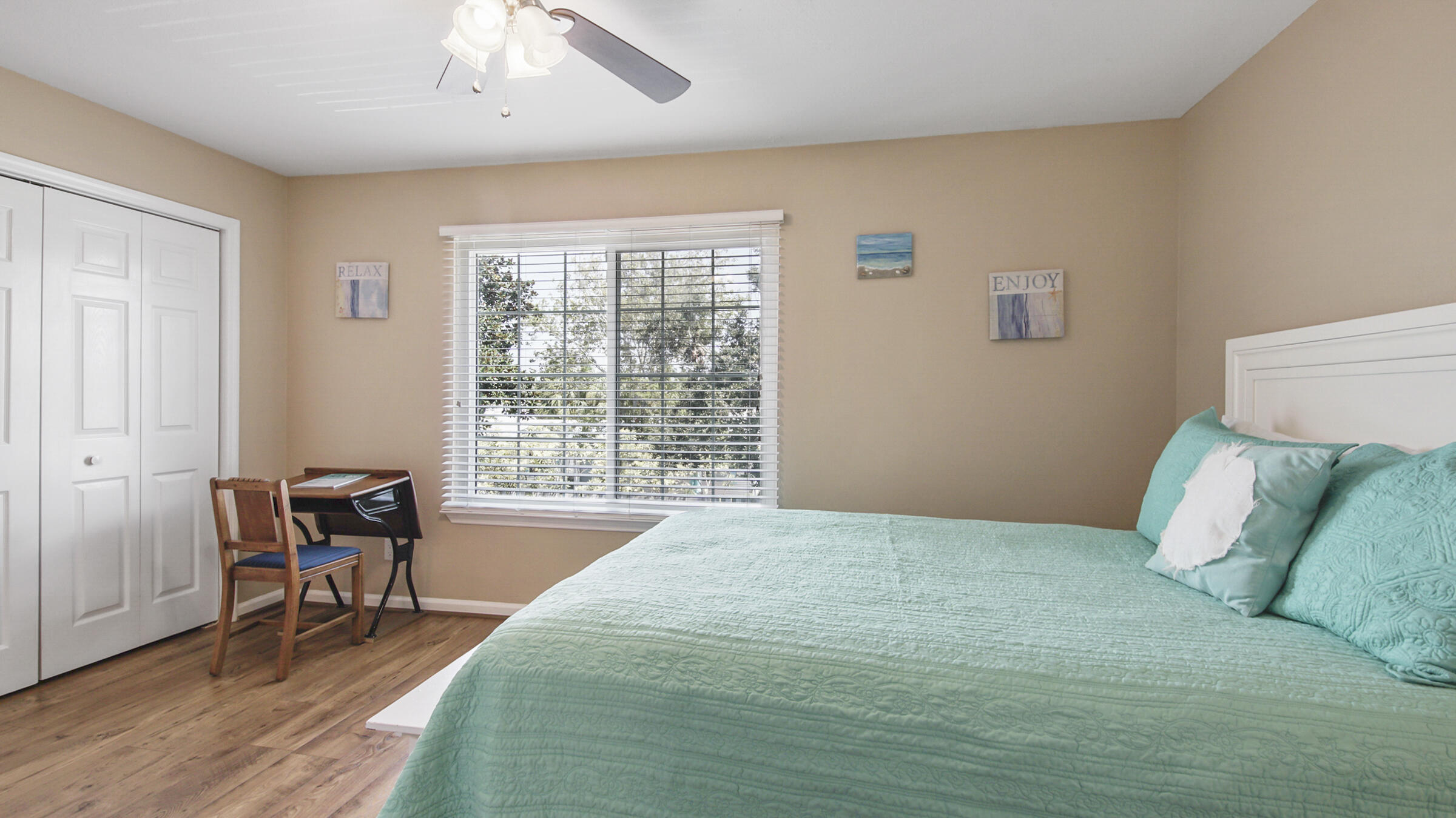 241 Ellis Road, Unit 51 Miramar Beach, FL 32550 - Photo 12 of 34 a bedroom with a bed and a chair