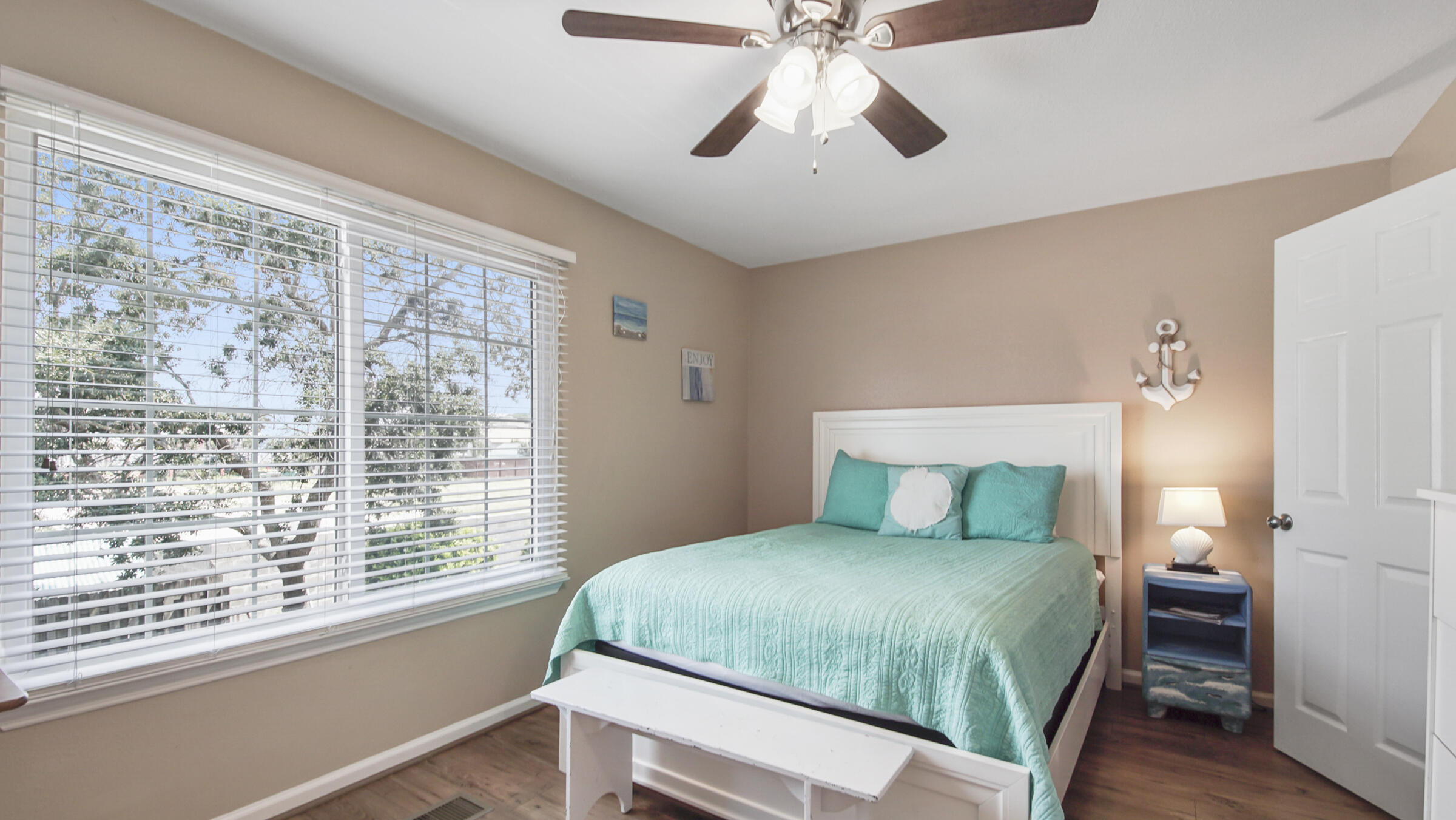 241 Ellis Road, Unit 51 Miramar Beach, FL 32550 - Photo 13 of 34 a bedroom with a large bed and a window