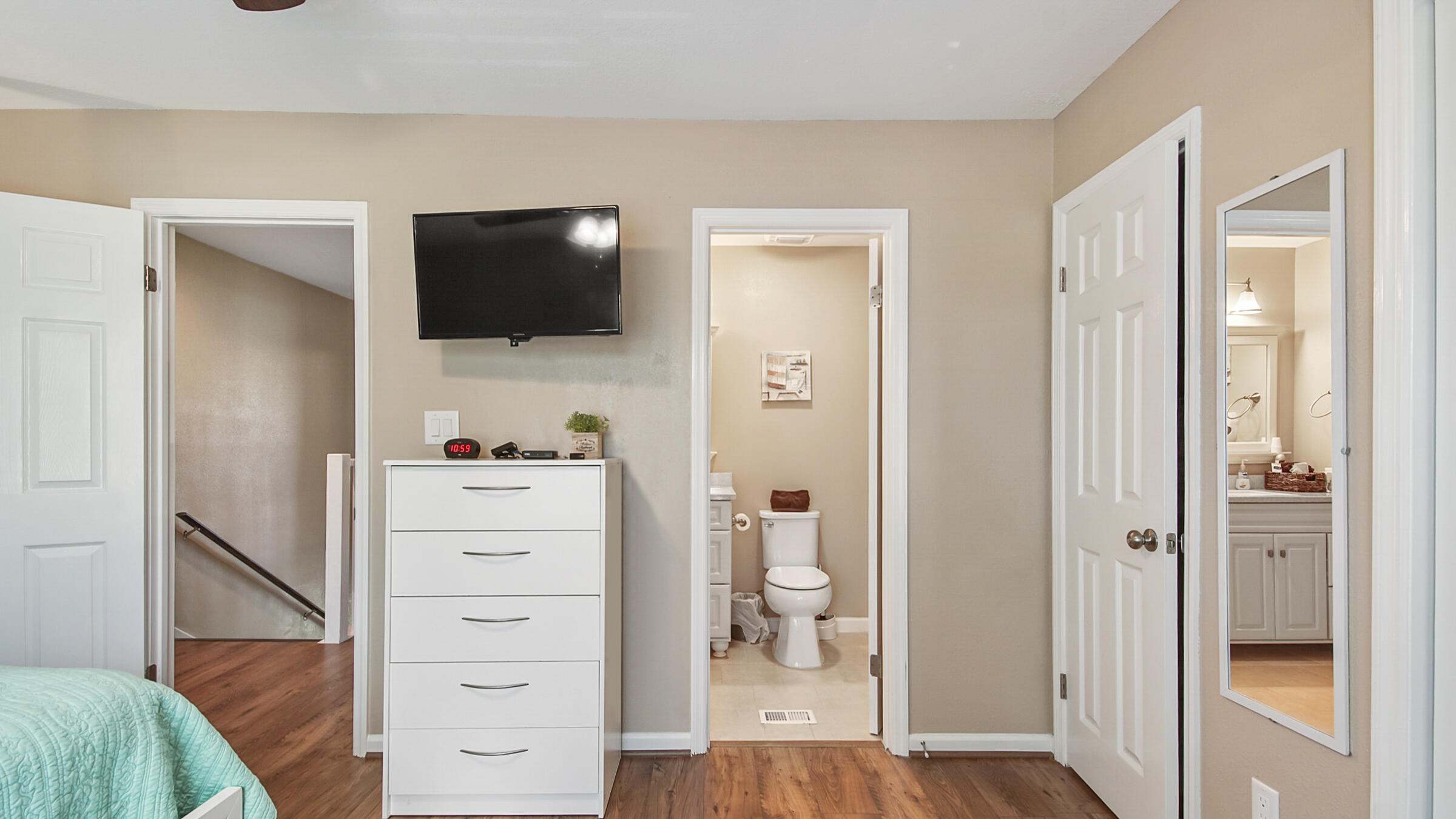 241 Ellis Road, Unit 51 Miramar Beach, FL 32550 - Photo 14 of 34 a view of bedroom with a flat screen tv on the wall