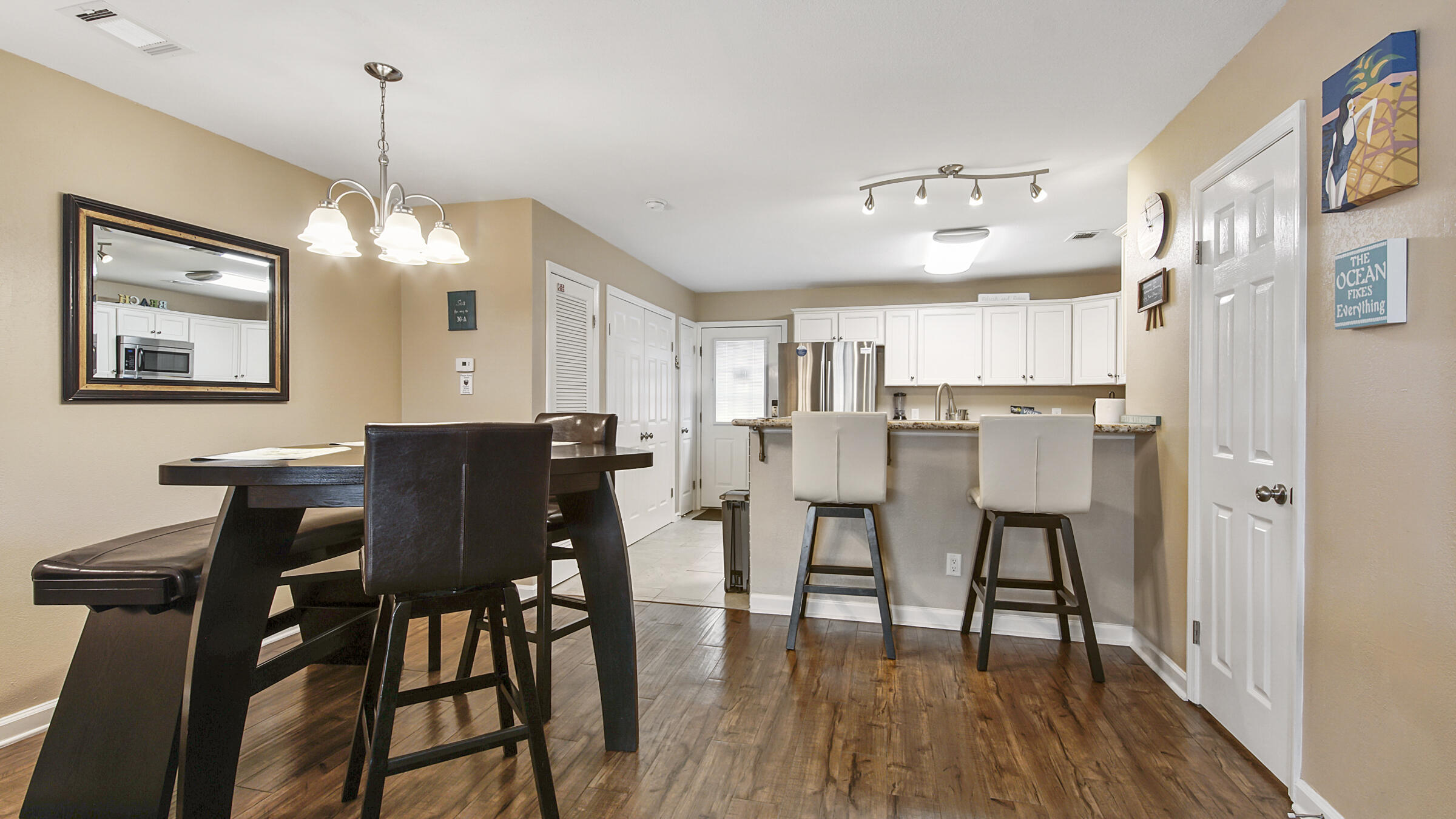 241 Ellis Road, Unit 51 Miramar Beach, FL 32550 - Photo 5 of 34 a view of a dining room with furniture and wooden floor