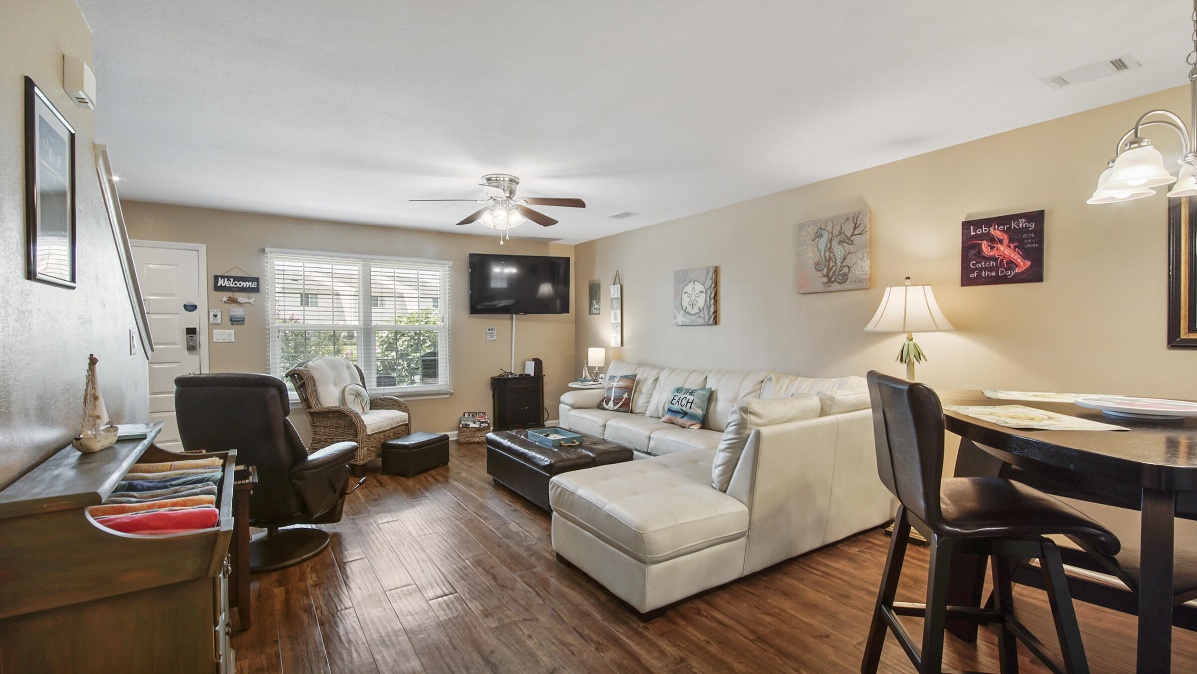 241 Ellis Road, Unit 51 Miramar Beach, FL 32550 - Photo 6 of 34 a living room with furniture fireplace and flat screen tv