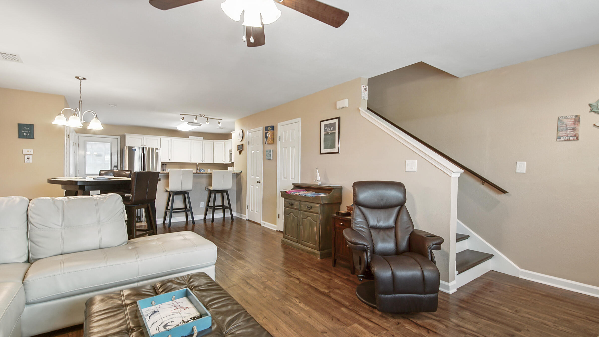 241 Ellis Road, Unit 51 Miramar Beach, FL 32550 - Photo 7 of 34 a living room with furniture and wooden floor