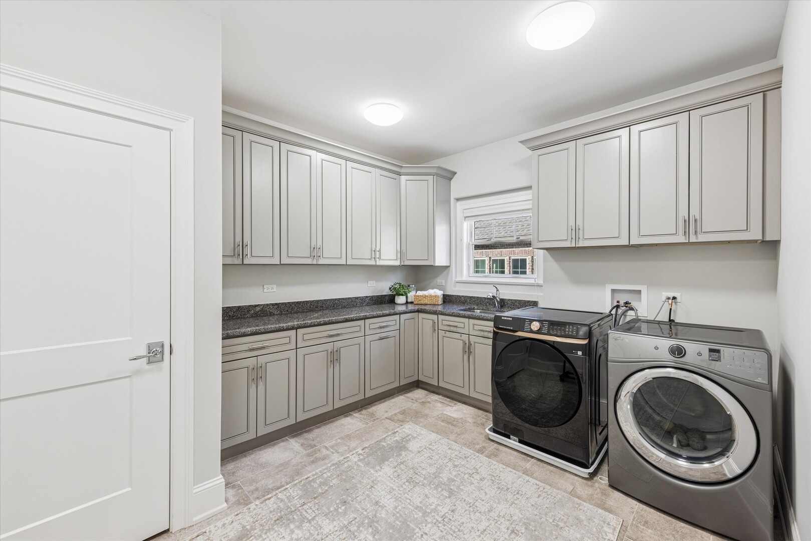 502 South Fairview Avenue Elmhurst, IL 60126 - Photo 17 of 36 a kitchen with a sink cabinets and a washer dryer
