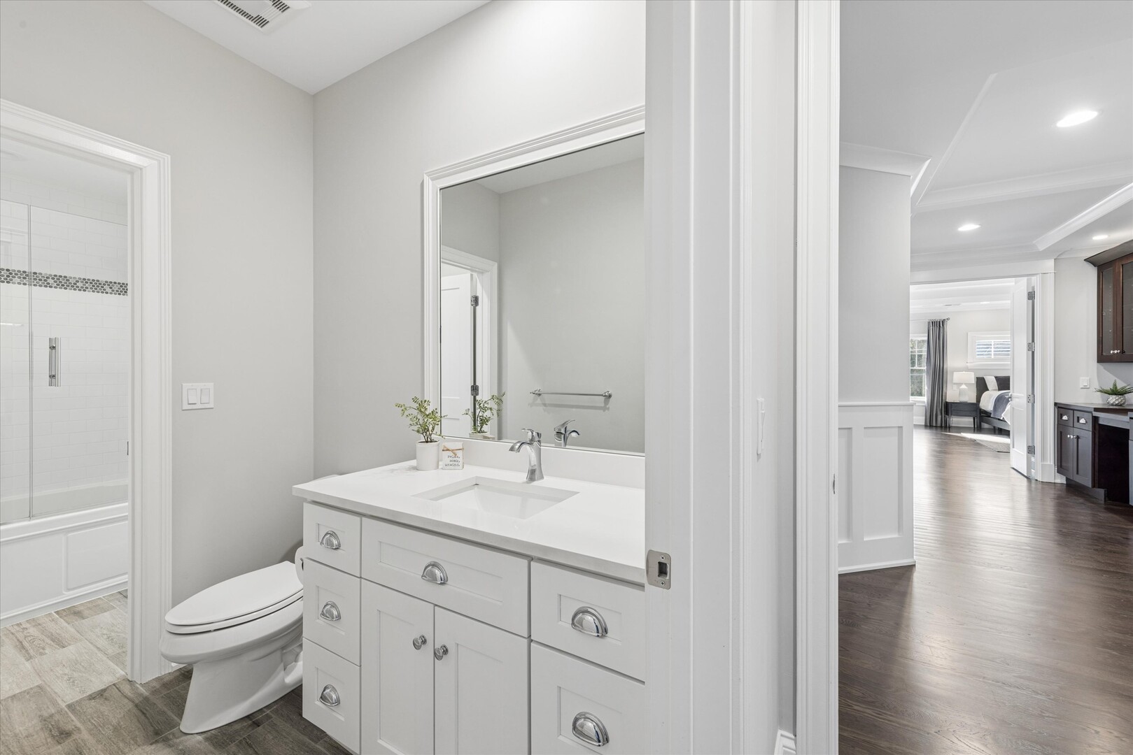 502 South Fairview Avenue Elmhurst, IL 60126 - Photo 21 of 36 a bathroom with a toilet a sink and a large mirror