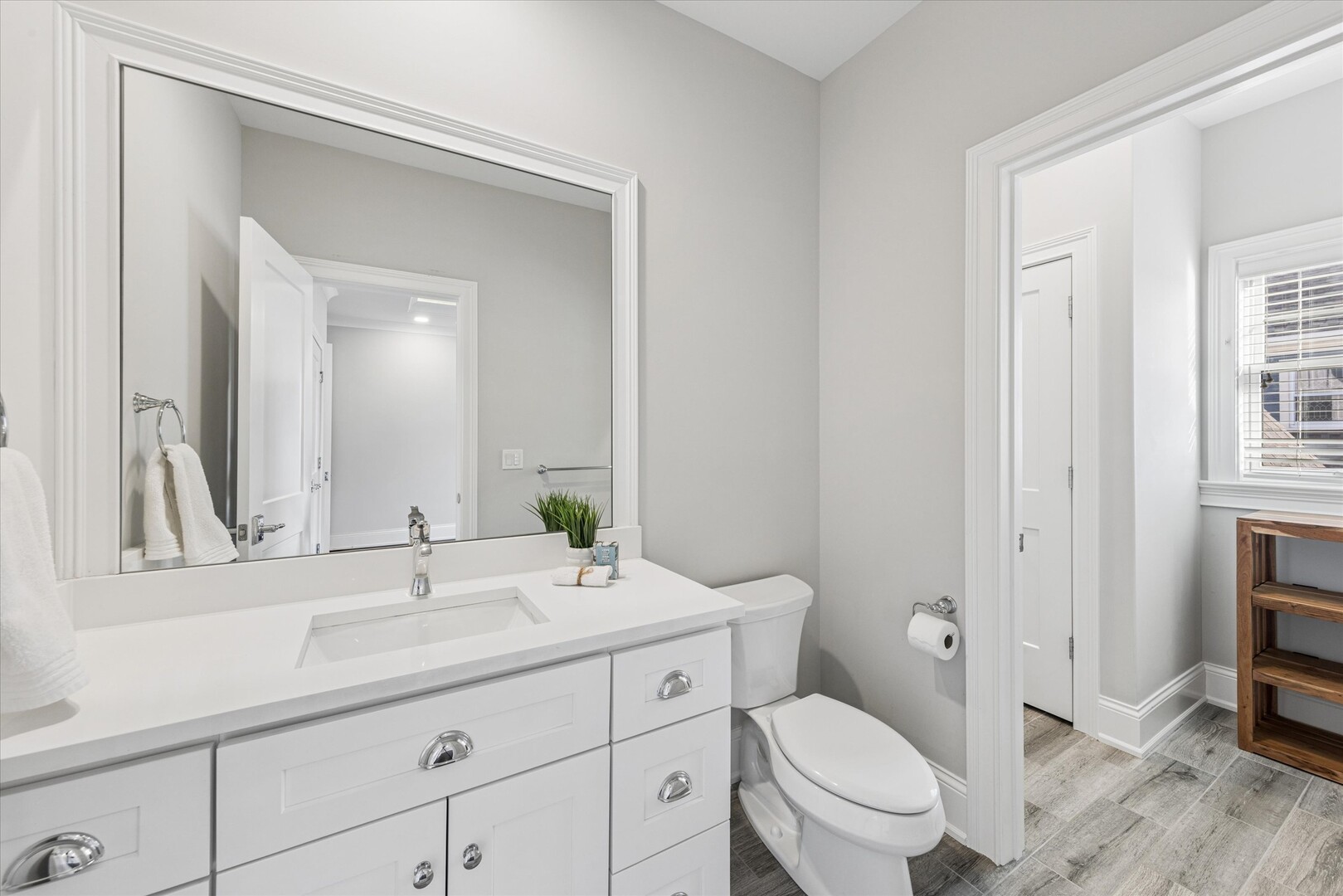 502 South Fairview Avenue Elmhurst, IL 60126 - Photo 23 of 36 a bathroom with a toilet a sink and mirror