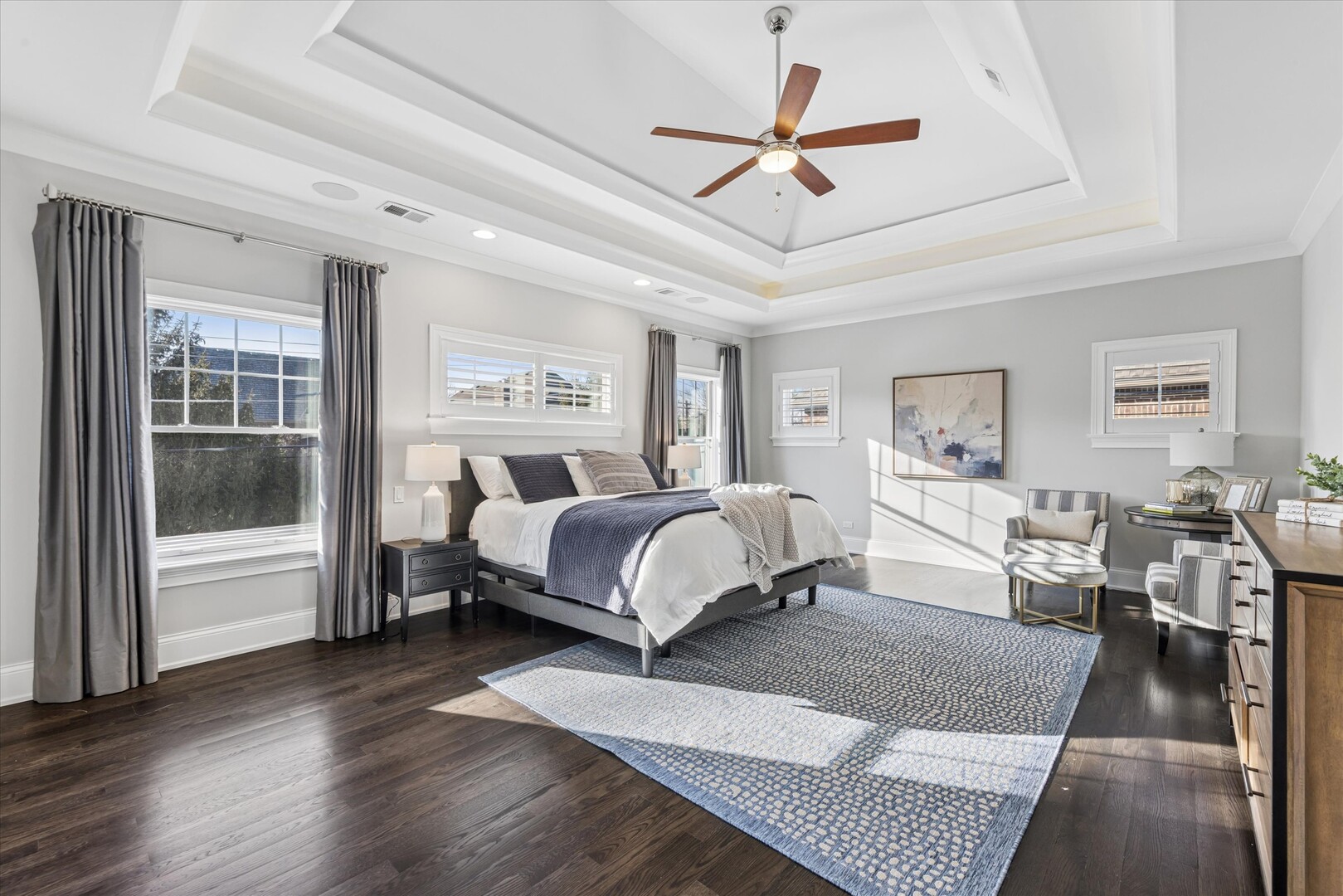 502 South Fairview Avenue Elmhurst, IL 60126 - Photo 24 of 36 a spacious bedroom with a large bed a chandelier and windows