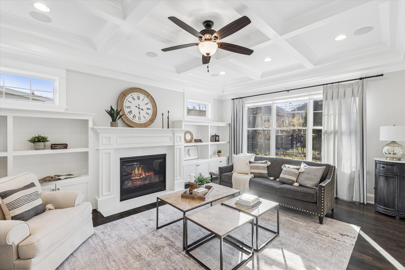 502 South Fairview Avenue Elmhurst, IL 60126 - Photo 4 of 36 a living room with furniture a clock and a fireplace