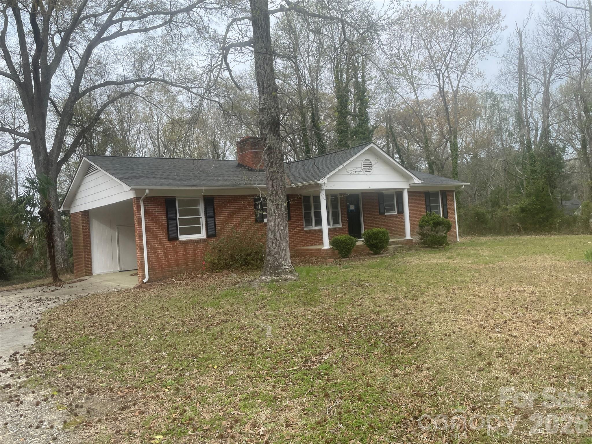 2801 Lyndell Way Lancaster, SC 29720 - Photo 2 of 10 a front view of a house with a yard and garage