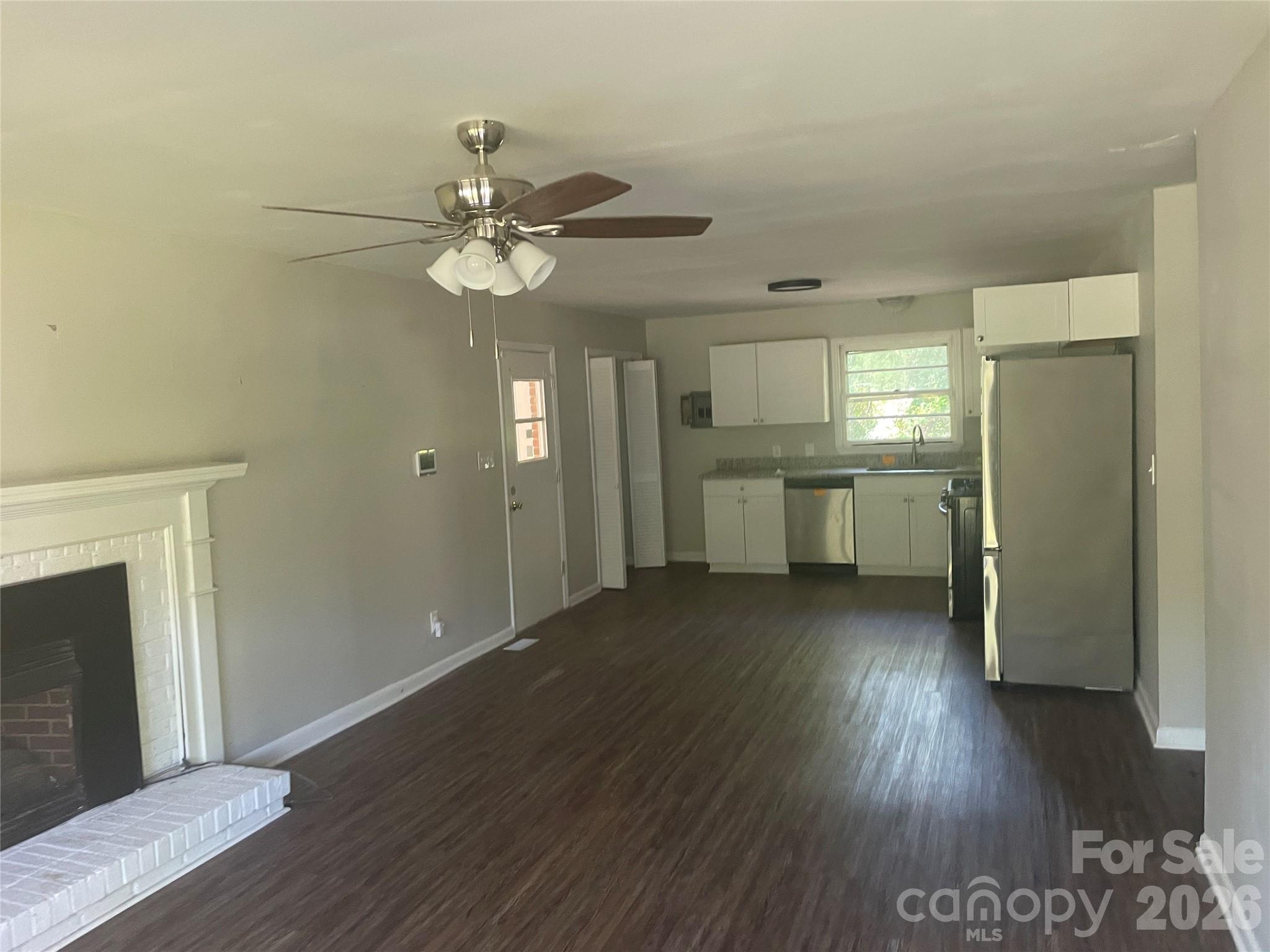 2801 Lyndell Way Lancaster, SC 29720 - Photo 6 of 10 a view of a kitchen with a dishwasher a kitchen wooden floor and a ceiling fan