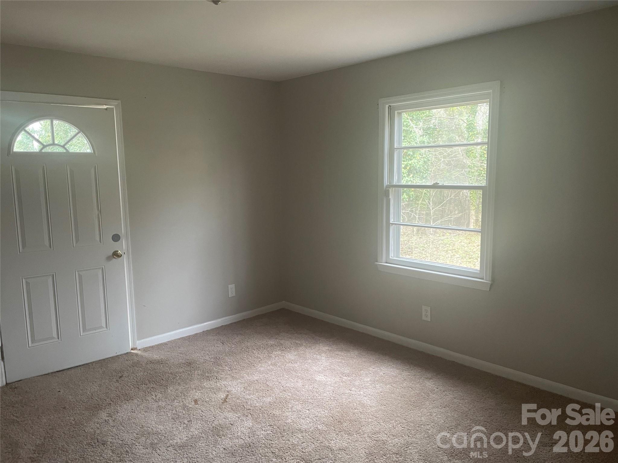 2801 Lyndell Way Lancaster, SC 29720 - Photo 7 of 10 an empty room with windows
