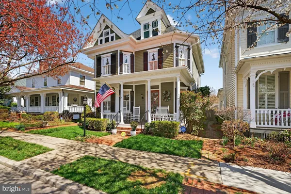 a front view of a house with garden and porch