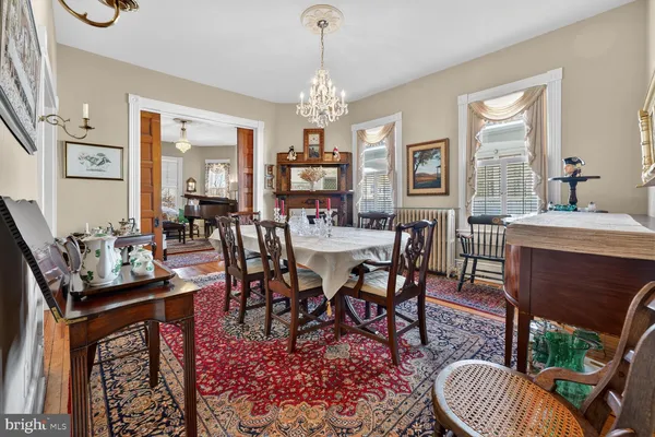 a bedroom with furniture and a rug