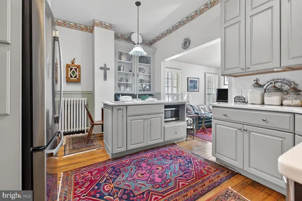 a kitchen with cabinets a sink and appliances