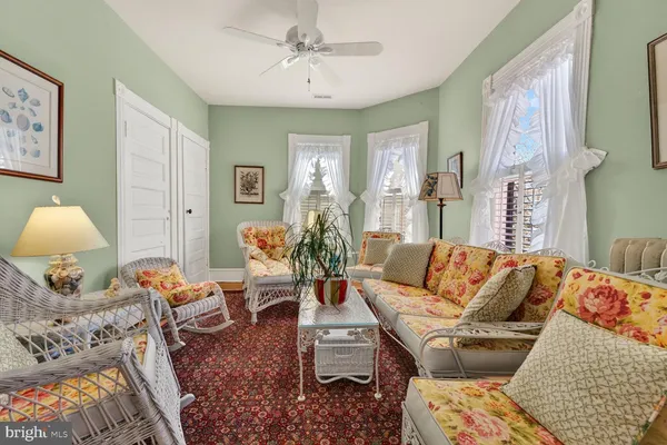 a large bathroom with a sink a mirror and a bath tub