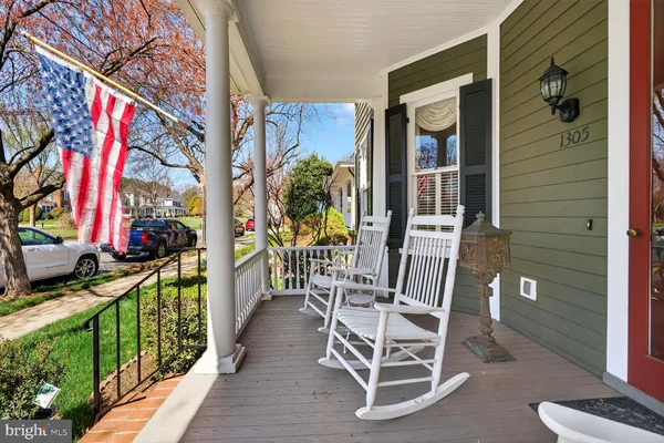 a living room with furniture rug and window