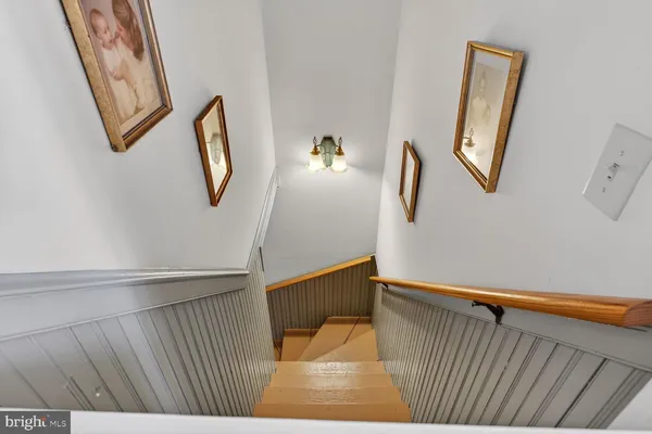 a view of a patio with table and chairs with wooden floor and fence