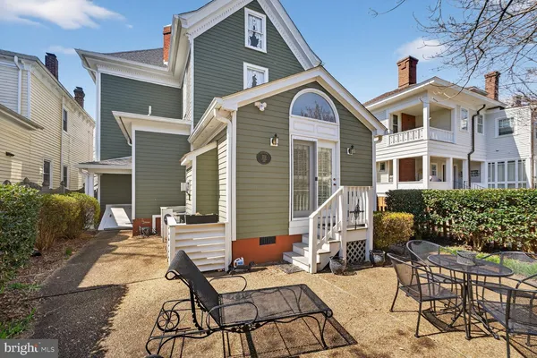 a view of a backyard with sitting area