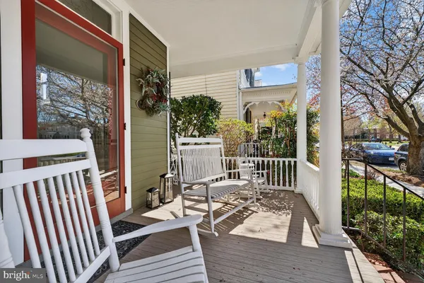 a living room with furniture rug and window