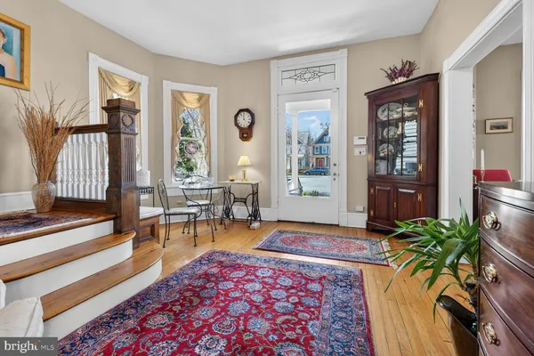 a living room with furniture and a rug