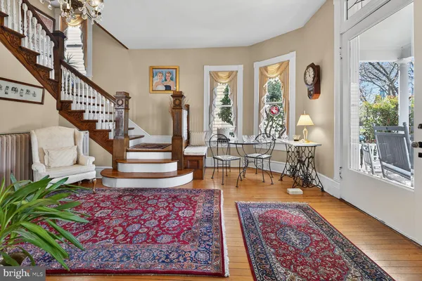 a living room with furniture and a rug