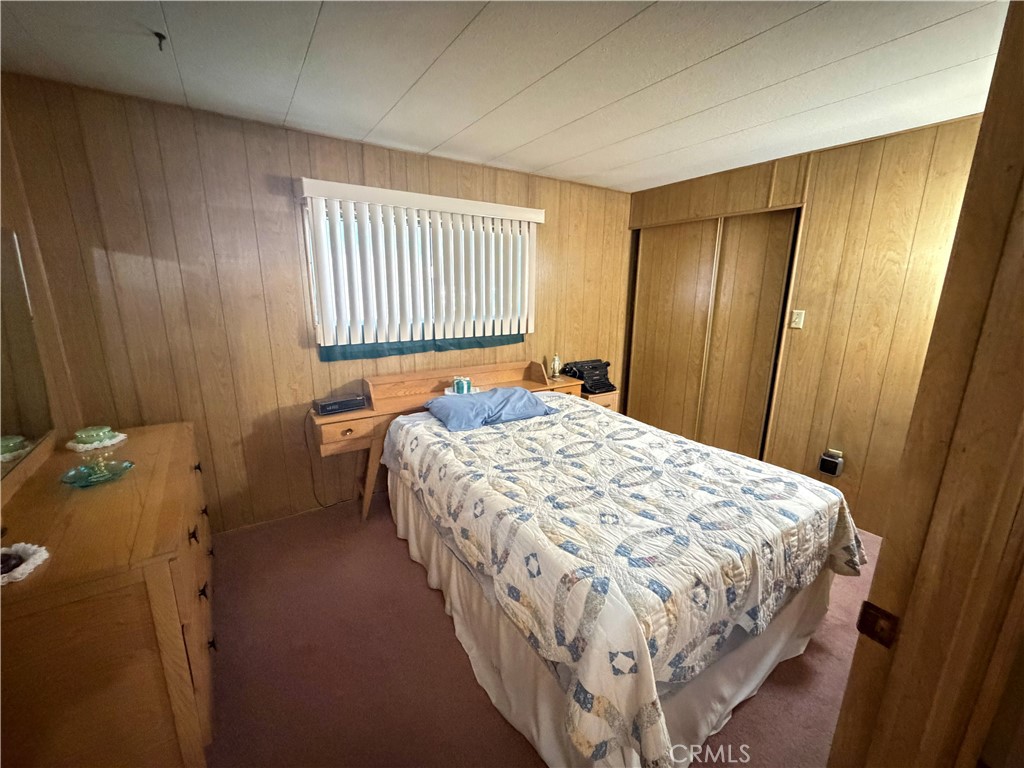 3701 Fillmore Street, Unit 64 Riverside, CA 92505 - Photo 16 of 26 a bedroom with a bed and a window