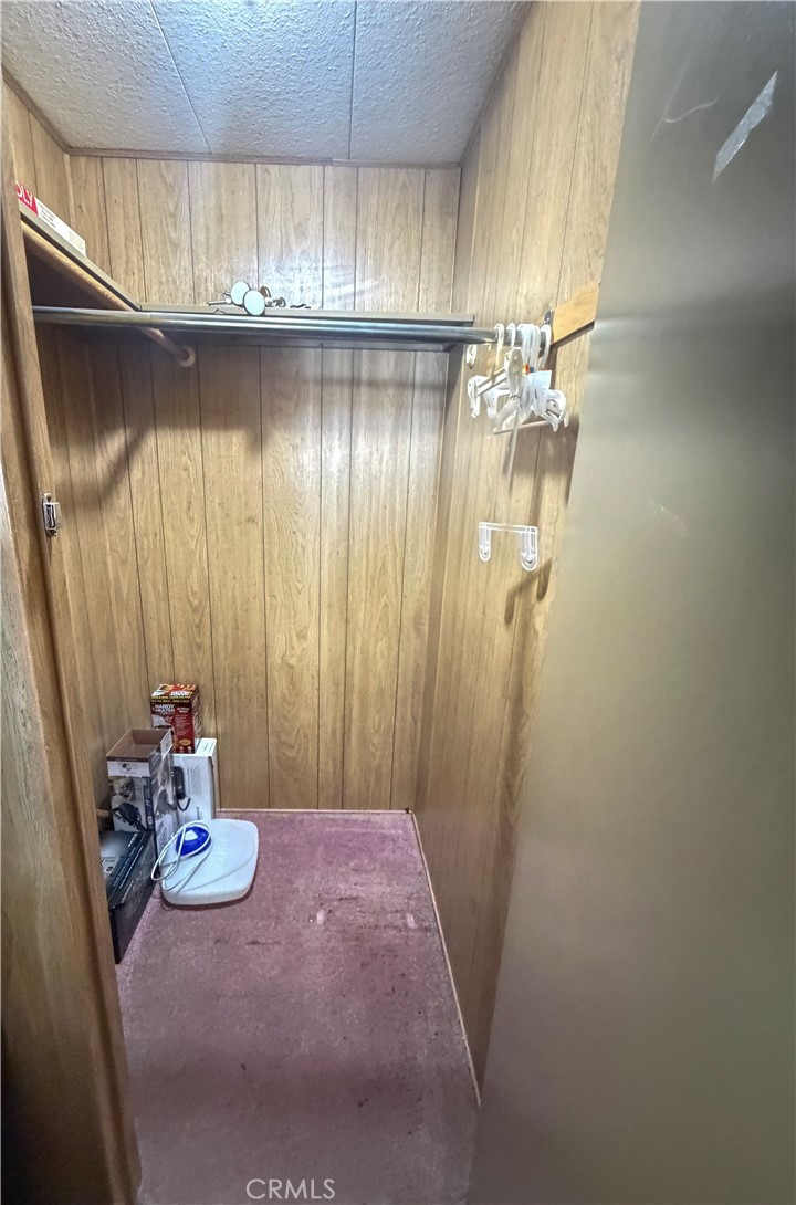 3701 Fillmore Street, Unit 64 Riverside, CA 92505 - Photo 18 of 26 a bathroom with a granite countertop shower a sink and a mirror