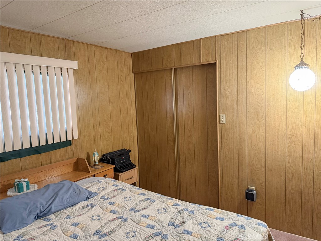3701 Fillmore Street, Unit 64 Riverside, CA 92505 - Photo 20 of 26 a bedroom with a bed and a window