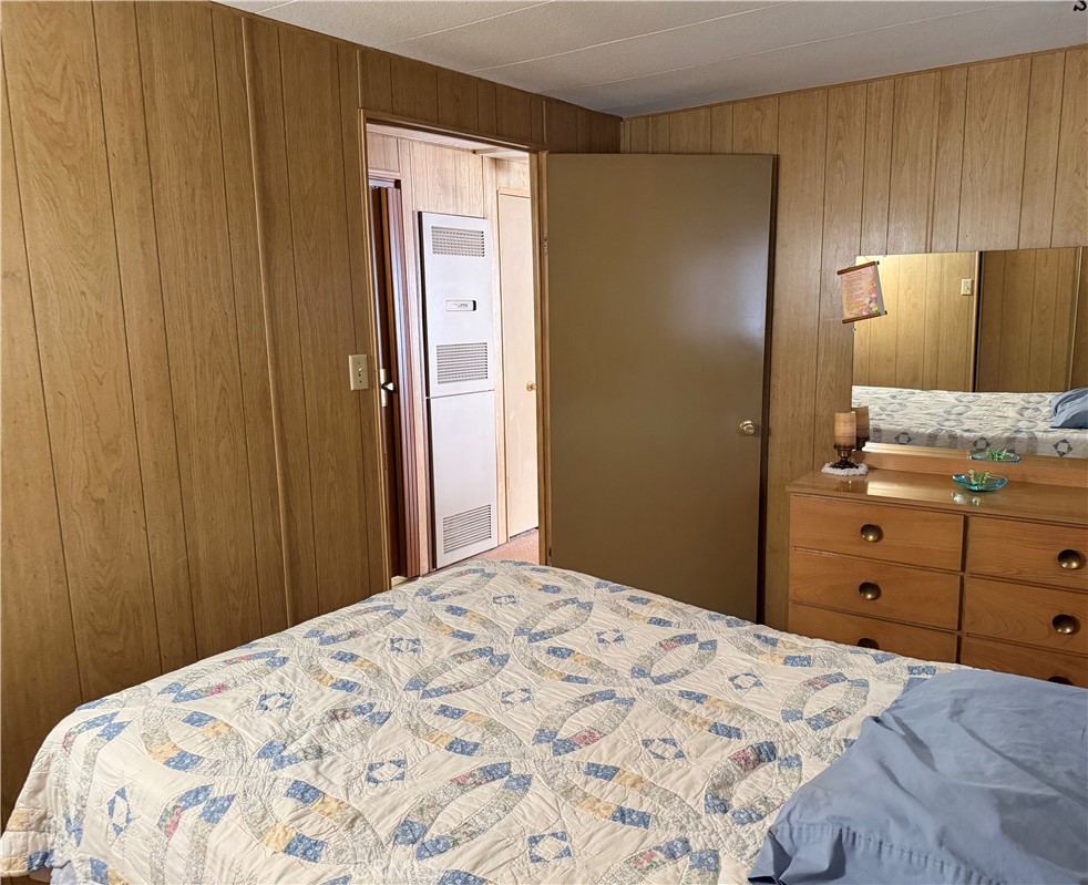 3701 Fillmore Street, Unit 64 Riverside, CA 92505 - Photo 23 of 26 a bedroom with a bed and cabinet